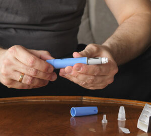 obese fat man preparing Semaglutide Ozempic injection control blood sugar levels